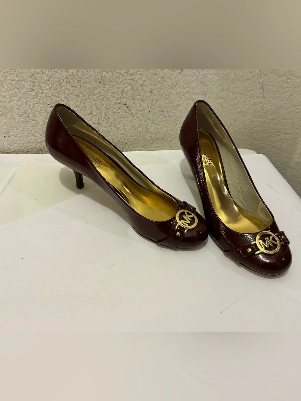 Michael Kors Burgundy Patent Leather Mid-Heel Pumps with Gold MK Emblem